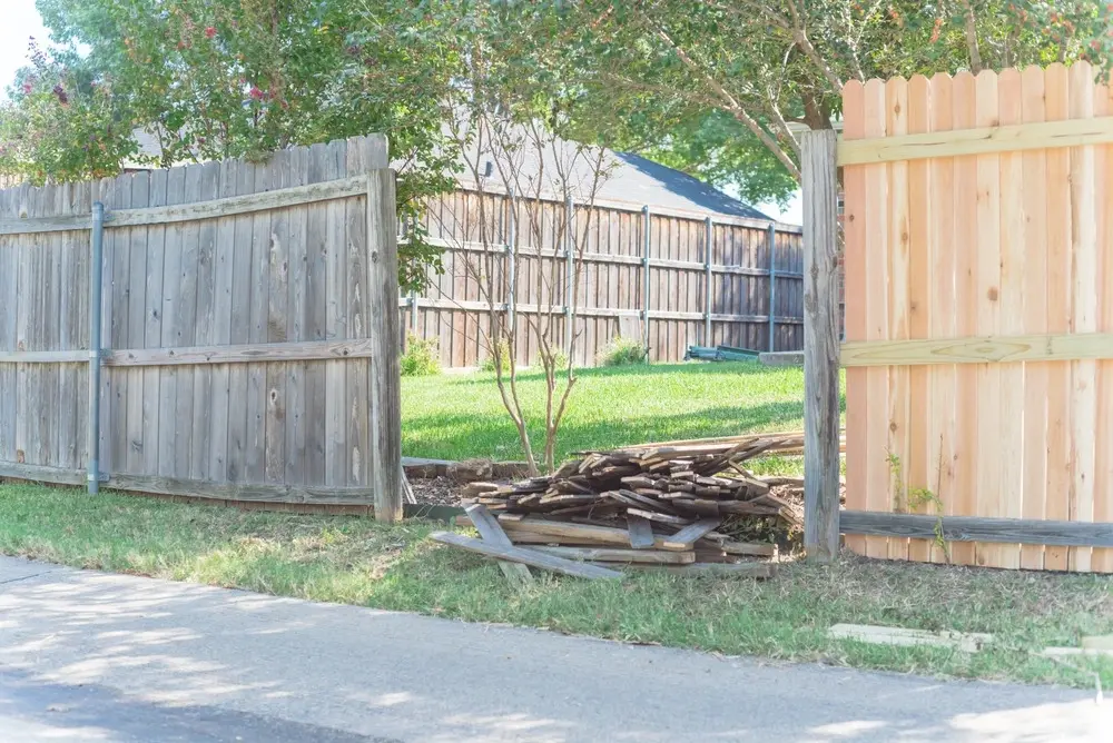 Fence in backyard being fixed.