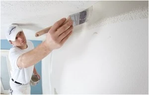 Painter Working on White Ceiling