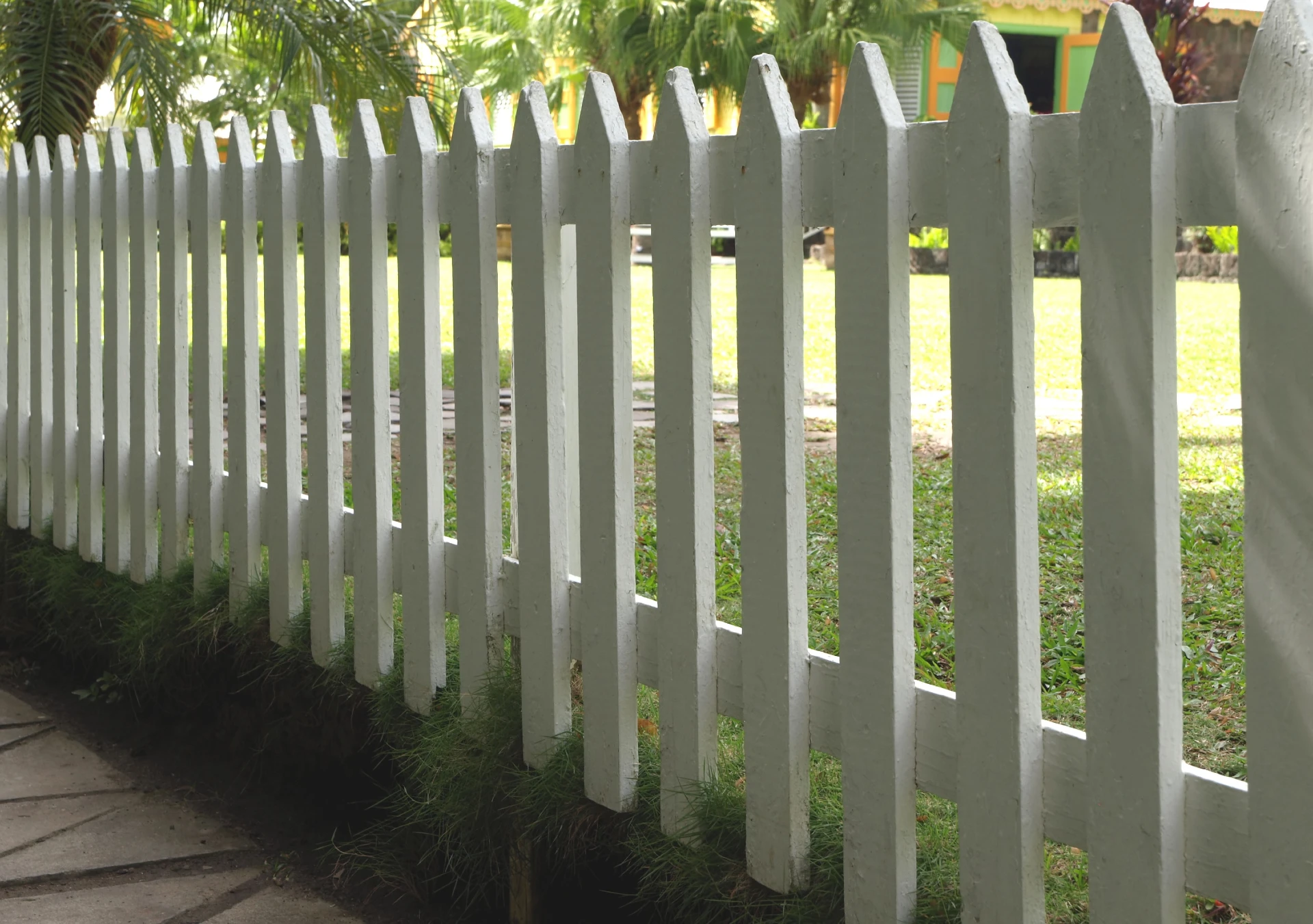 Photo of a white picket fence