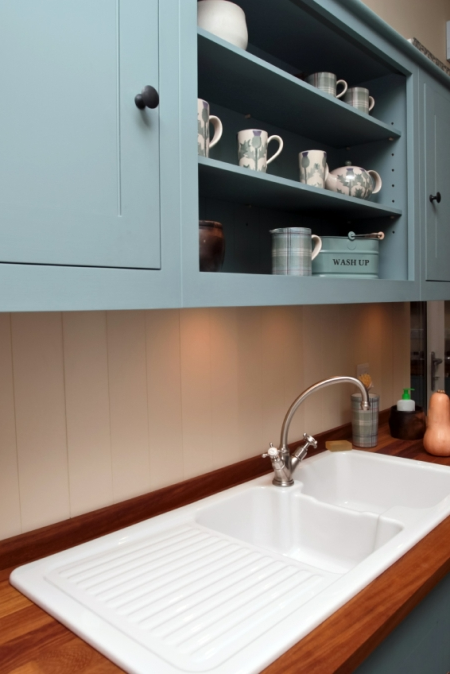 Light Blue Cabinets and Shelving in a Kitchen