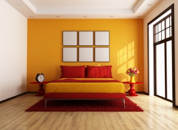 Bedroom with orange accent wall   