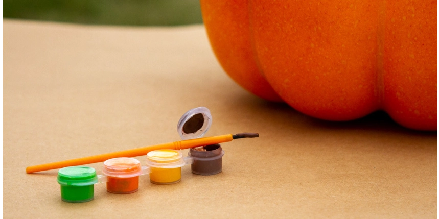 A pumpkin with painting materials