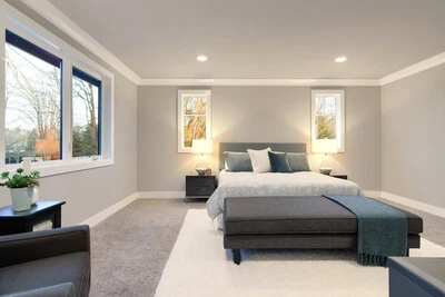 Calming master bedroom with a gray and white exterior paint job